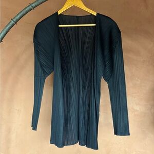 Black Issey Miyake Pleats Please cardigan.